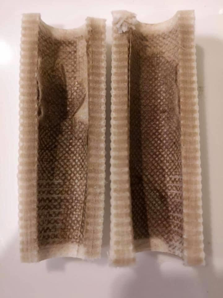 Used filter after 30 days showing trapped rust and sediment from UK tap water